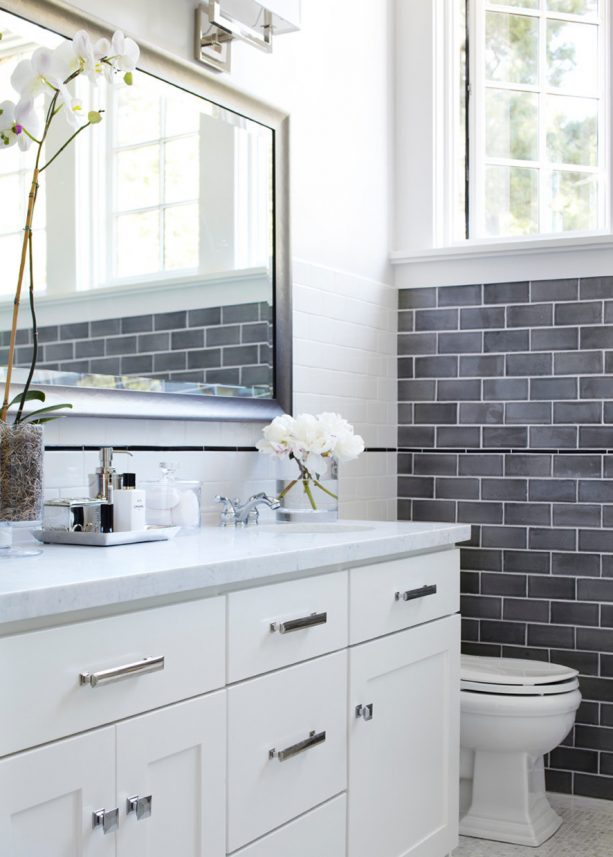 white bathroom with grey subway tile wall