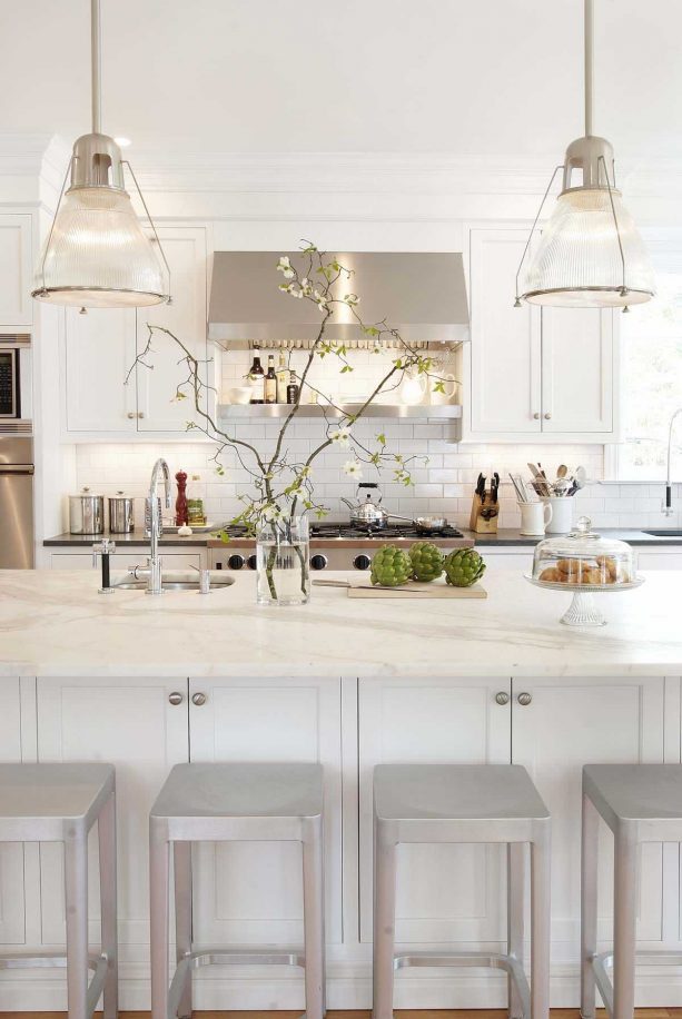 off-white cabinets paired with warm white granite countertops