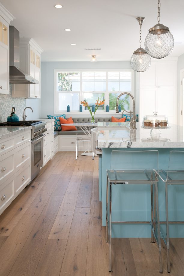 white shaker cabinets paired with a blue island