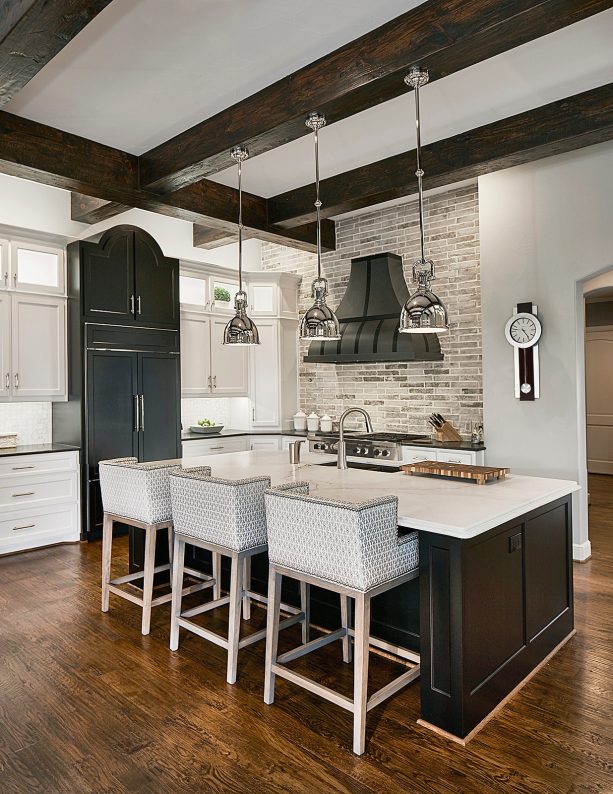 white shaker kitchen cabinets paired with black kitchen island