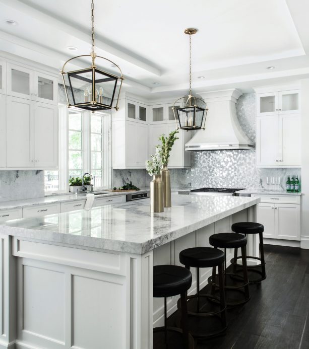 white shaker kitchen cabinets paired with metallic silver white backsplash