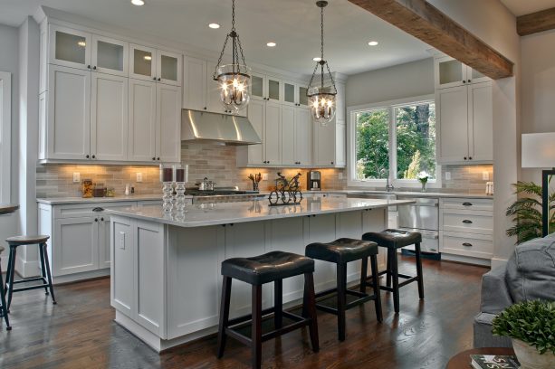 white shaker kitchen cabinets with simple round knobs