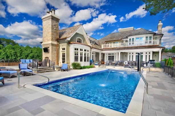 outdoor inground pool with spray water feature