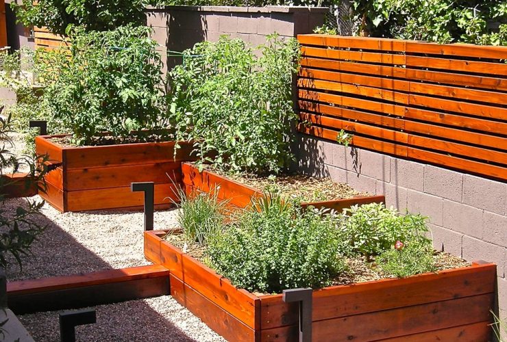 fencing from cinder block and wood with compatible planters