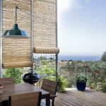 balcony with bamboo blinds for protection from sunlight