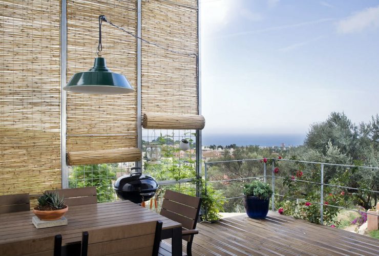 balcony with bamboo blinds for protection from sunlight