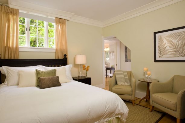 contemporary bedroom with short wide window and sheer beige curtains