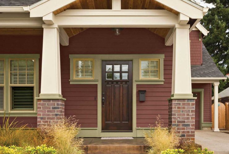 front door with brown stain and oyster tan-painted trim