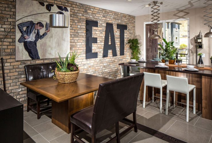 a dining room accent wall made from thin brick tile