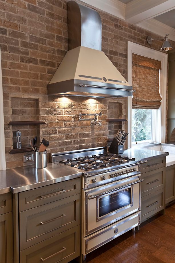 brick tile to add texture on the wall and backsplash of a farmhouse kitchen