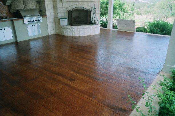 brown concrete wood floor in an open kitchen