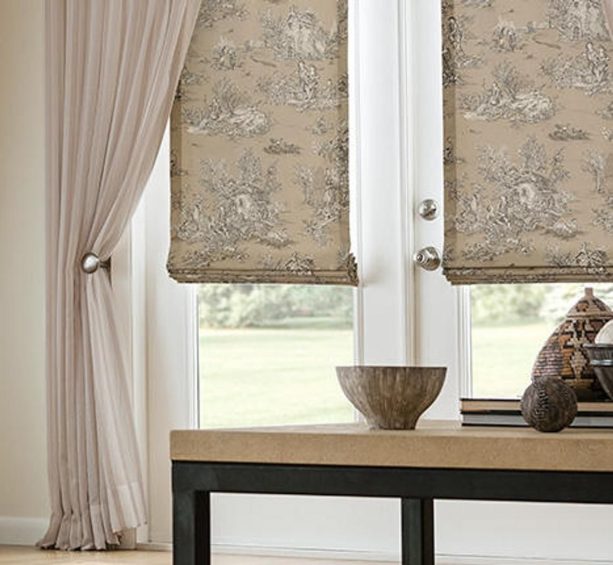 elegant-patterned blackout roman shade in flat style covering French doors