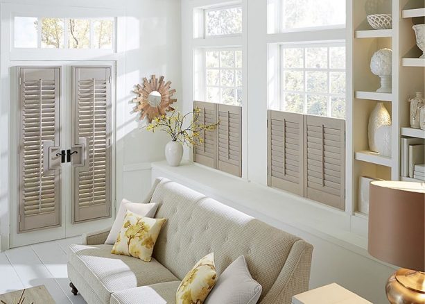 grey Graber plantation shutters covering white French doors