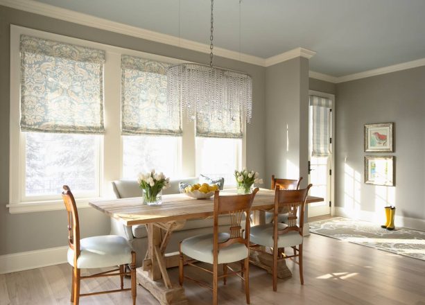 sheer blue stripe roman shade to allow subtle light through a French door