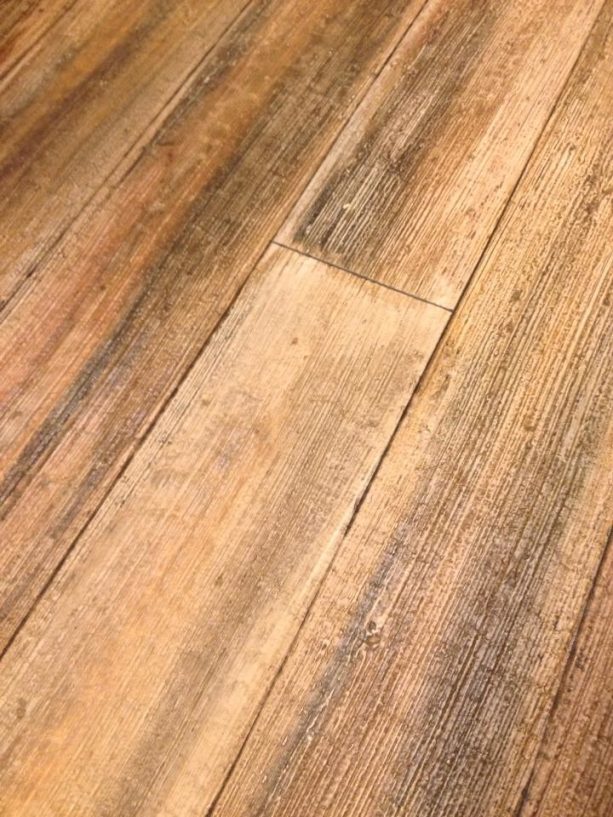 the result of light broom method on faux wood planks from concrete