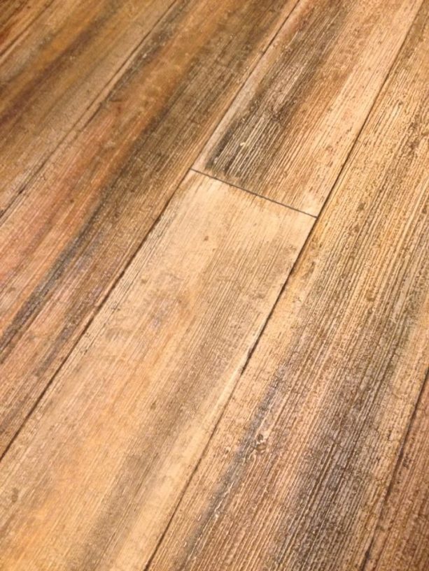 the result of light broom method on faux wood planks from concrete