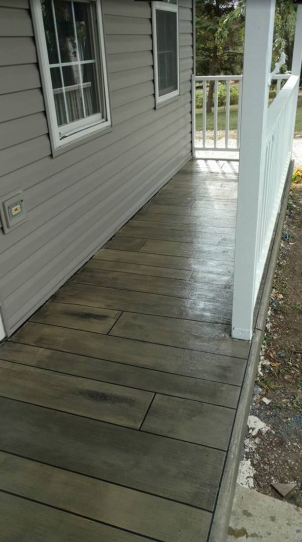 the use of medium tone concrete wood floor in porch area