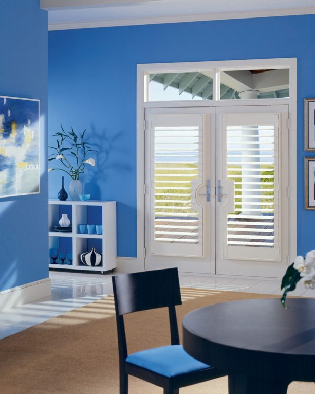 white Hunter Douglas plantation shutter to create a beach style on white French doors