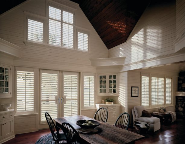 white-painted faux wood plantation shutters on white French doors