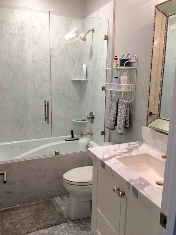 Rain Cloud solid surface as surround in a shower tub combo