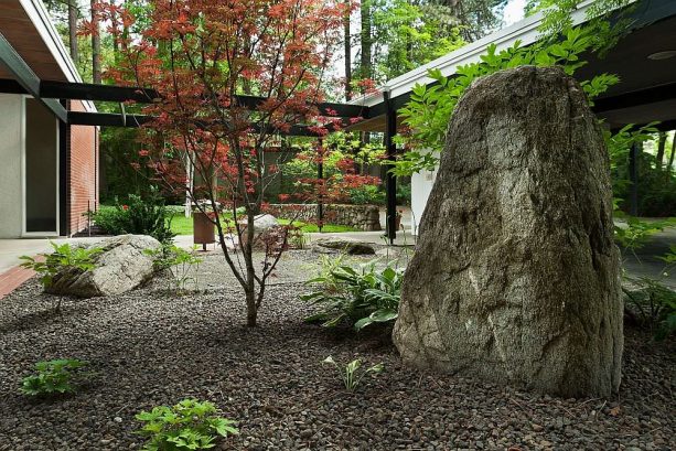a relaxing simple landscape with large boulders and mulch