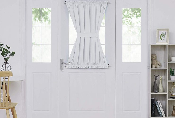 a white French door panel curtain with tieback for adding privacy in a half glass door design