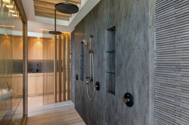 an open contemporary shower room with Lava Rock solid wall panels