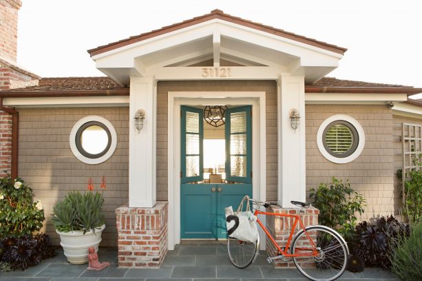 blue entry doors with glass-part covered by window film for subtle privacy