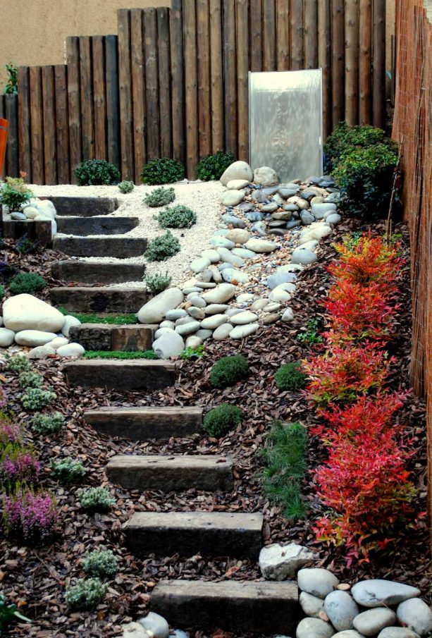 contemporary staircase landscape with white rocks and dried leaves mulch