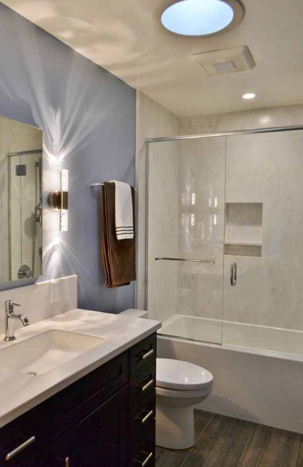 off white solid surface shower walls in a transitional bathroom