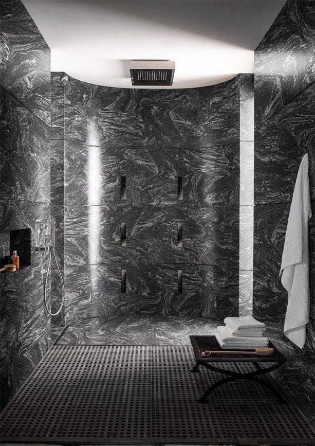 stunning Cosmos Prima black solid wall panels in a contemporary shower