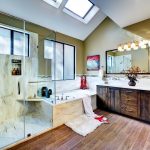 warm tone solid surface on the walls of a transitional shower