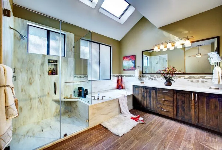 warm tone solid surface on the walls of a transitional shower