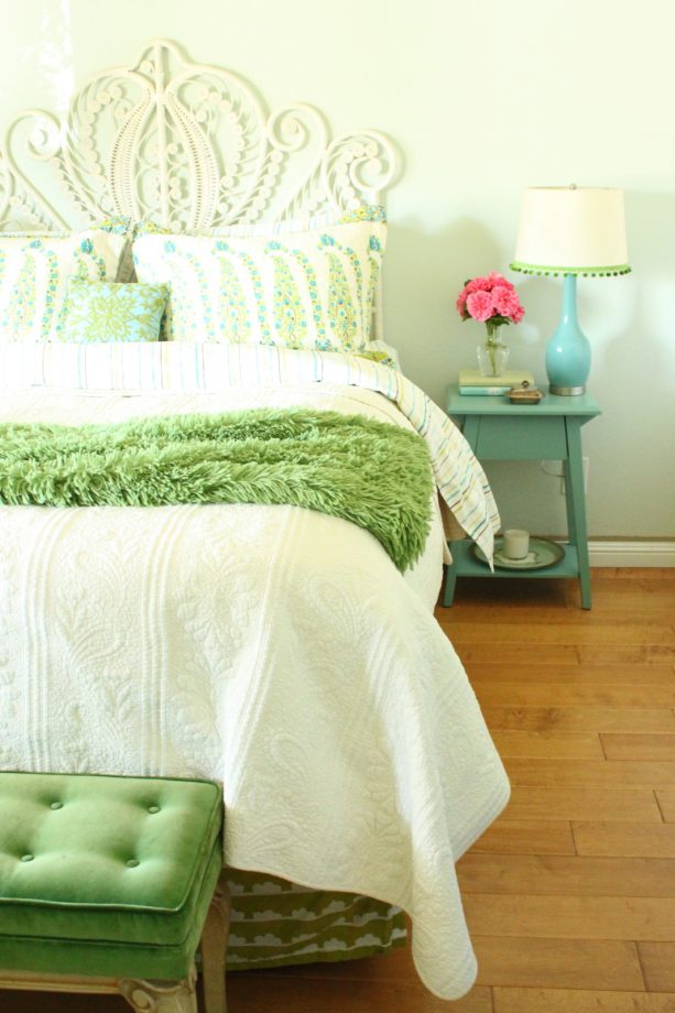a rustic bedroom with turquoise and green theme
