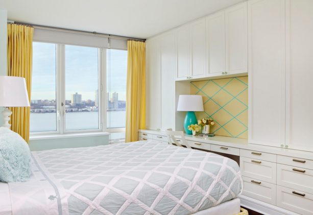 a transitional bedroom with turquoise and mustard yellow decorations