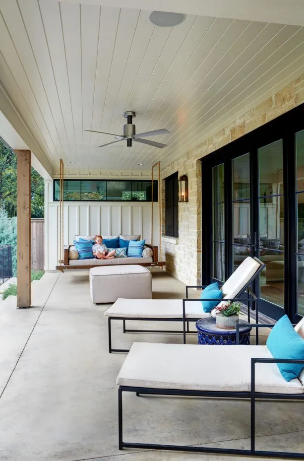 a transitional porch ceiling from white painted tongue and groove material