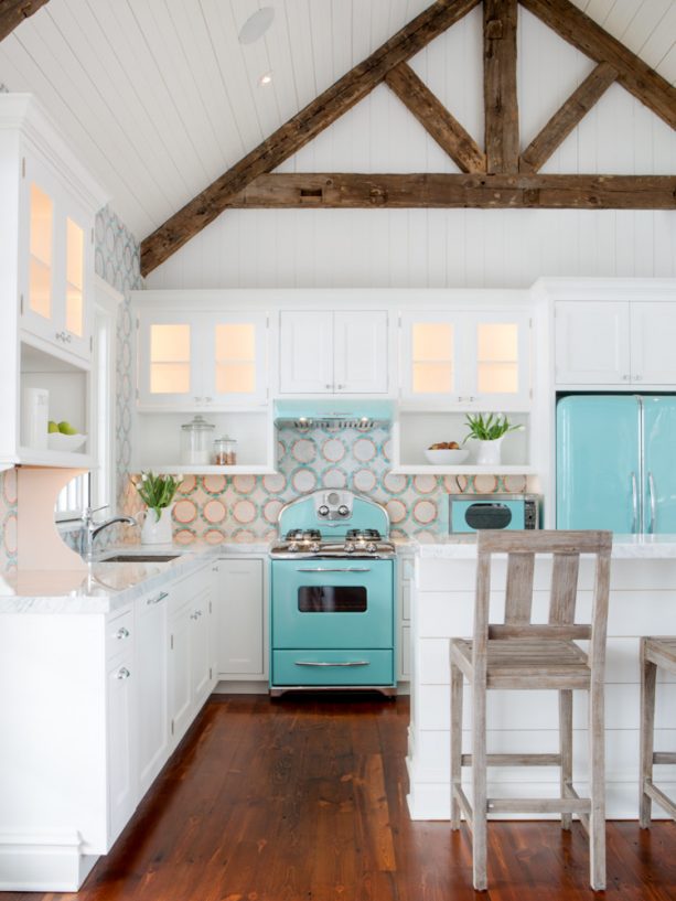 beach-style kitchen with turquoise appliances and white furniture