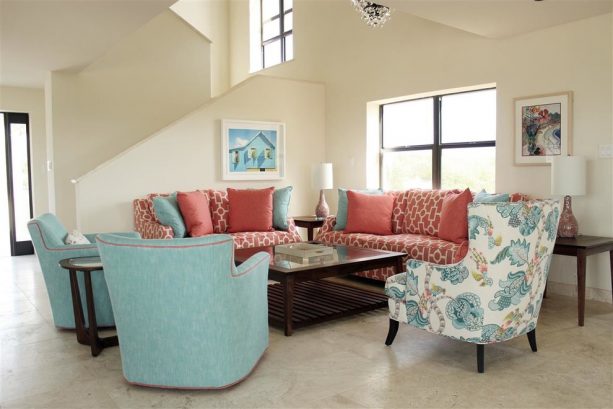 turquoise and coral furniture in a beach-style living room