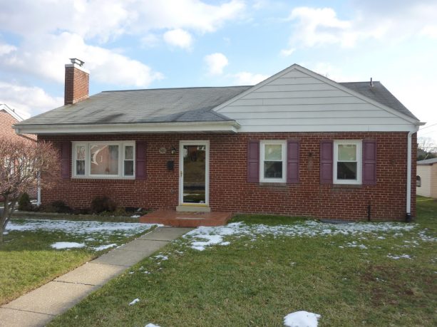 one-story brick ranch house before the addition project