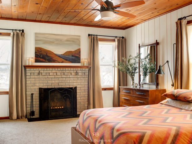 a yellow brick bedroom fireplace with grey concrete stain color