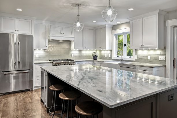 wall white shaker cabinets with lights under it