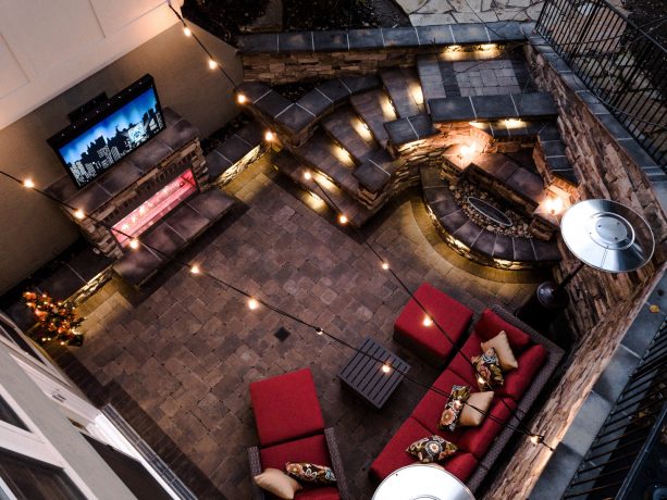a modern walkout basement patio with complete features and gorgeous lighting