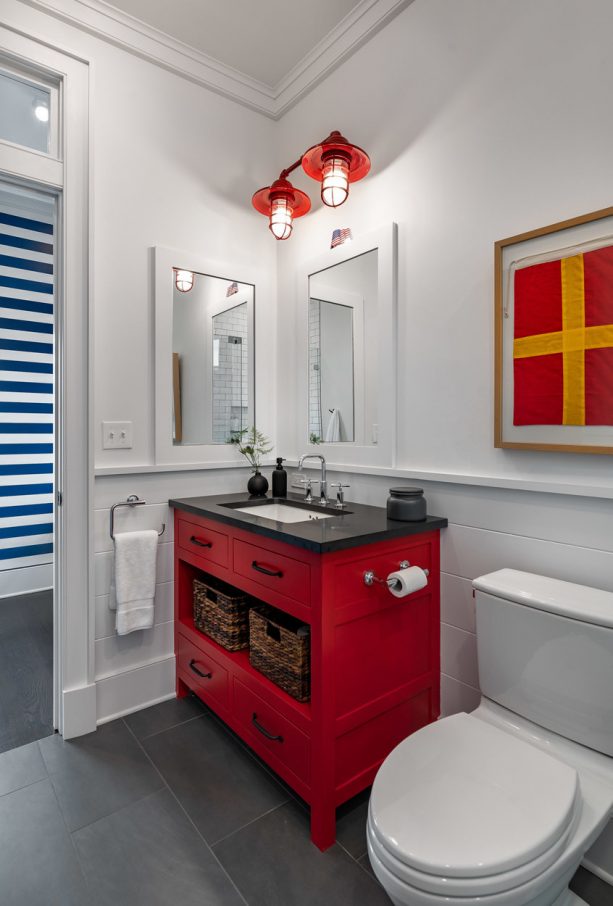 a red and black themed bathroom vanity with single-sink