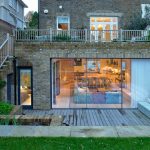 a transitional walkout basement patio with an amazing design