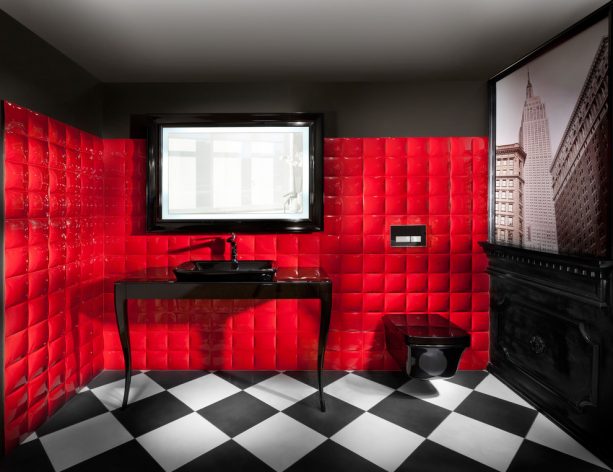 elegant red and black bathroom with unique red cushioned-like tiled wall