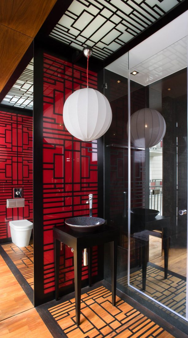 red and black decor in an Asian-themed bathroom