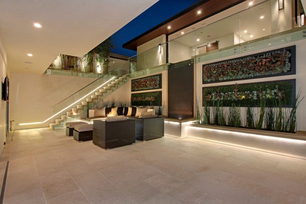the seating area, water feature, and vertical garden in the walkout basement patio