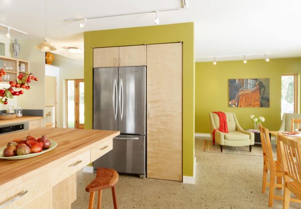 cabinets and refrigerator hidden inside the wall