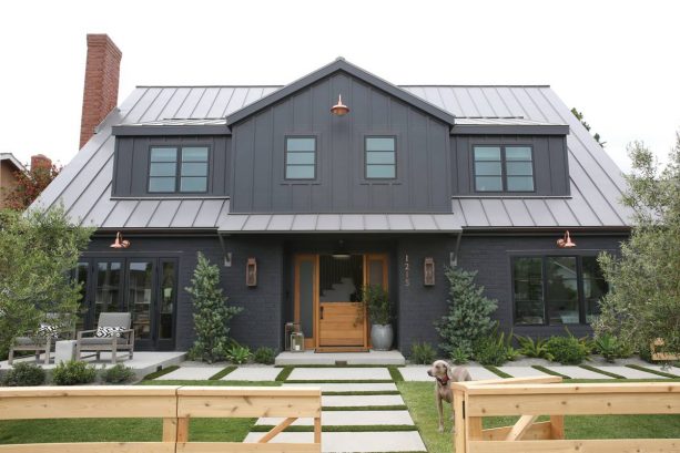 bold and stunning exterior with balck brick and black siding materials