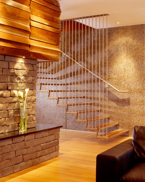 a modern basement floating staircase with open-style and ceiling-height guard